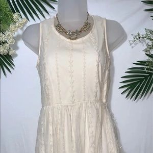 Creamy white floral lace dress.
